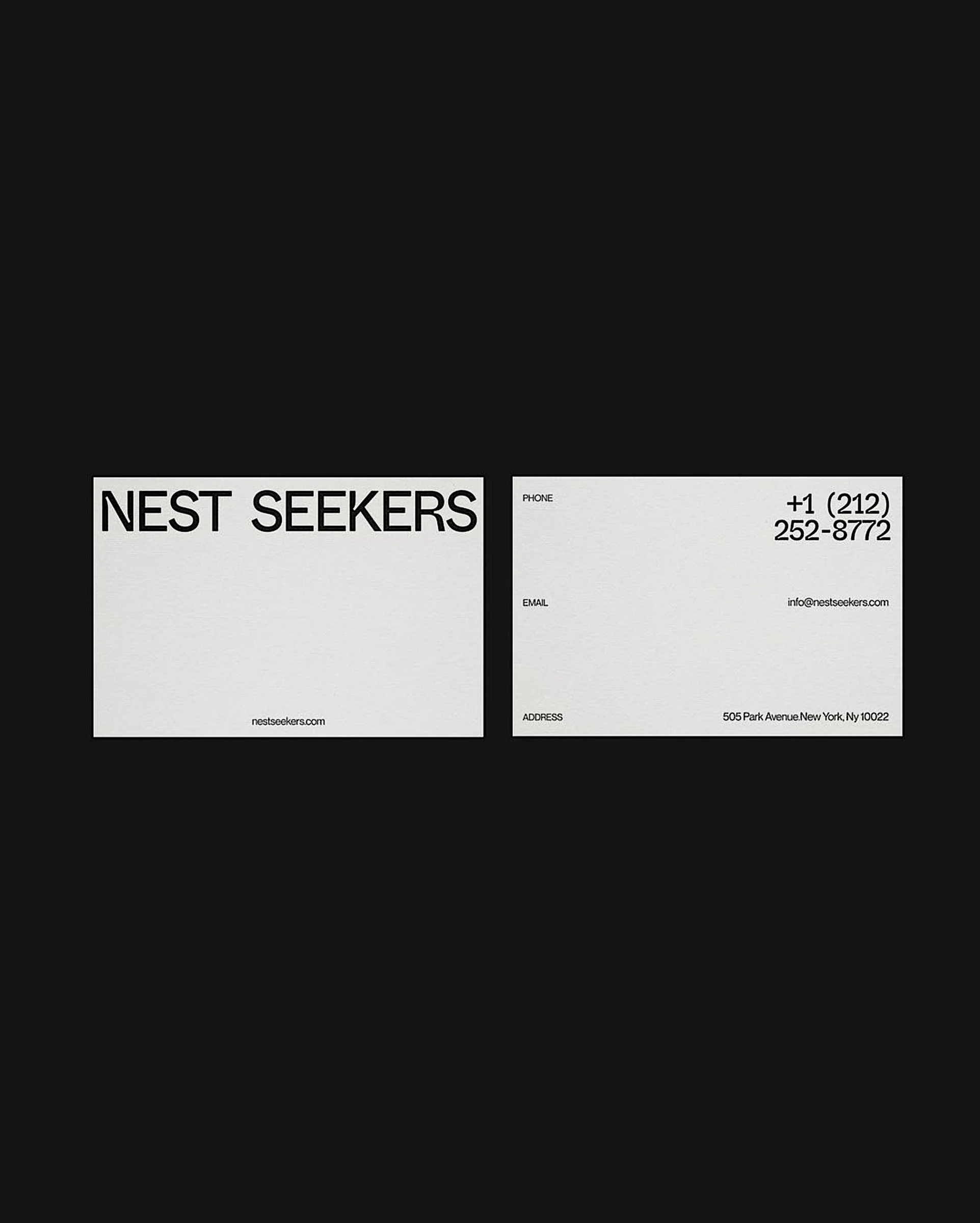 White business cards on black, front with black wordmark and back with phone, email and Park Avenue address, for Nest Seekers.
