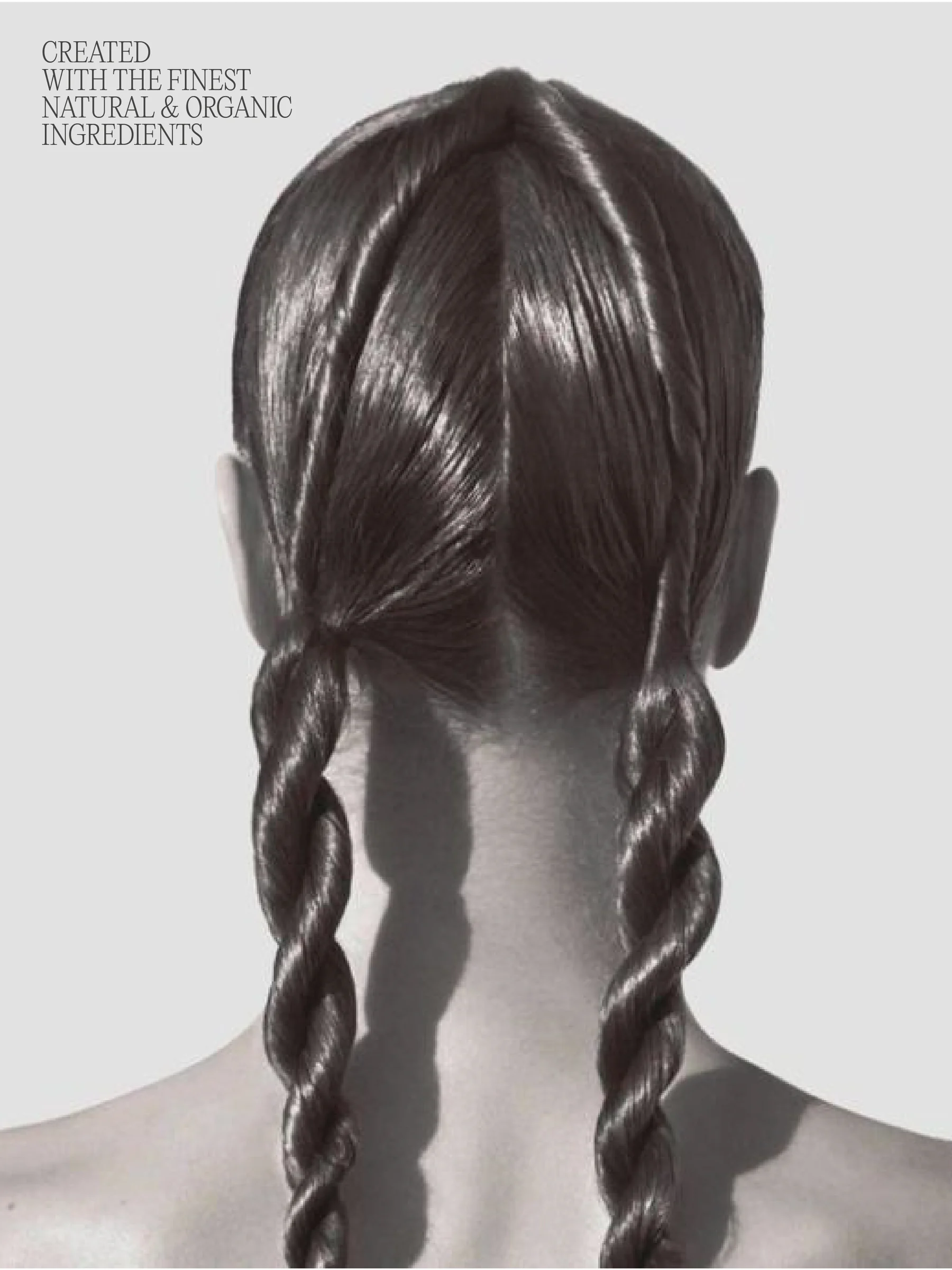 Back of a head with glossy twisted pigtail braids in black and white, with ingredient copy at top left, for Nobia.